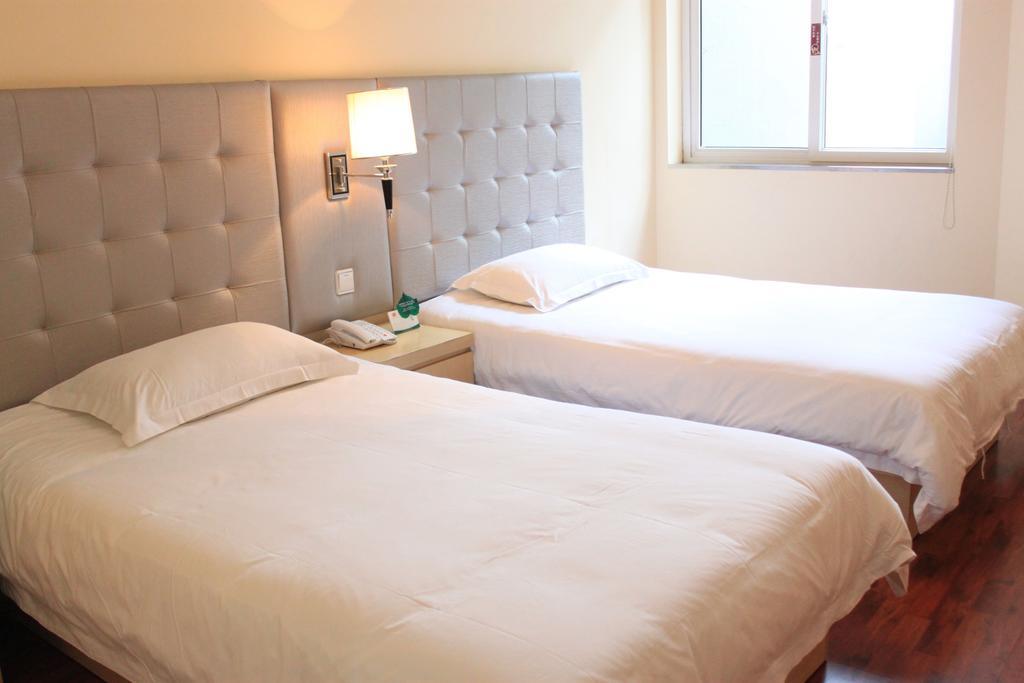 Qingdao Renjia Bussiness Hotel Habitación foto